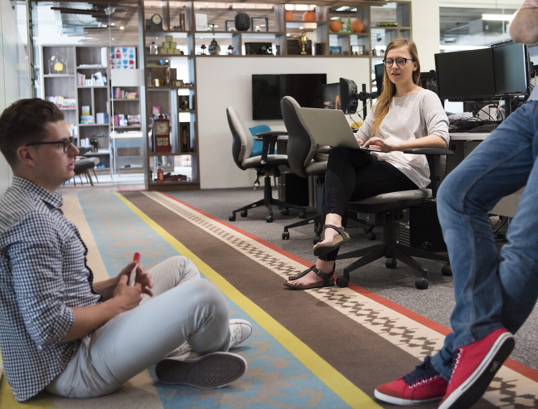 casual young people group in modern office have team meeting and brainstorming as they working everyday job